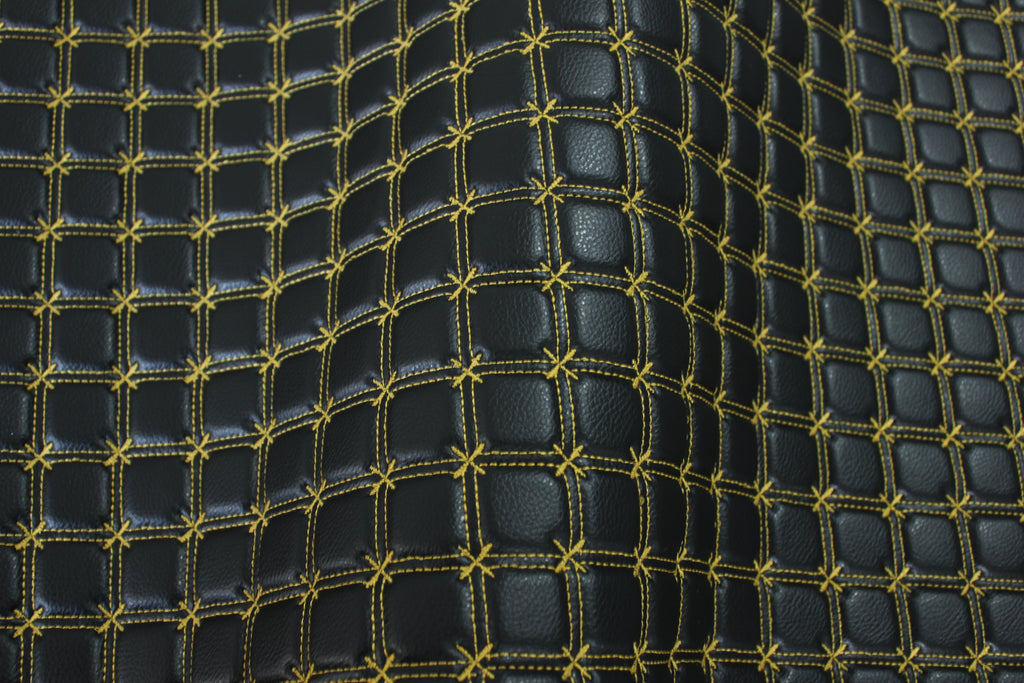 Tela de vinilo negro acolchado con cruz de copos de nieve dorados para tapicería de coche | Costura de 5 cm x 5 cm con refuerzo de espuma de 5 mm | 140 cm de ancho | Automotriz