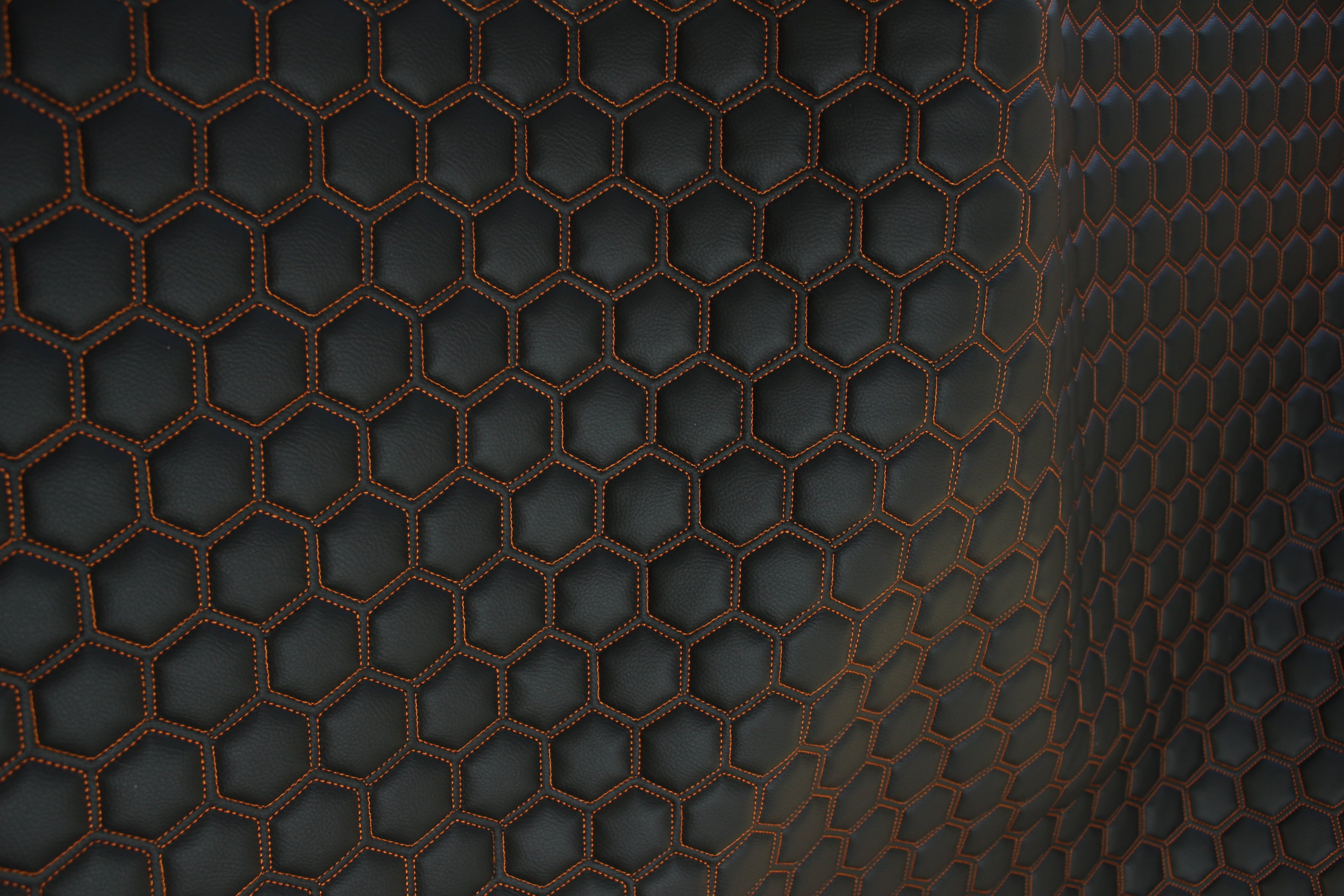 Orange Quilted Black Vinyl Faux Leather Car Upholstery Fabric | 2" x 5cm Hexagon Pattern Stitch with 5mm Foam Backing | 140cm Wide | Automotive